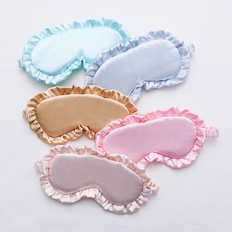 Set of satin sleep masks with ruffle trim and elastic straps in light blue and pinks