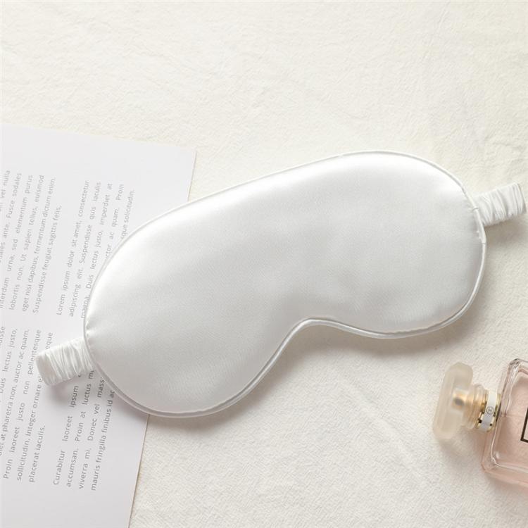 White satin sleep eye mask with elastic strap, smooth double-sided fabric.