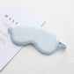 Light blue satin sleep eye mask with elastic strap, smooth double-sided fabric.