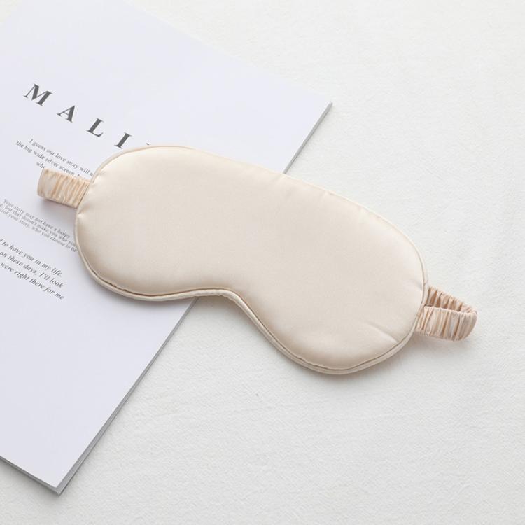 Beige satin sleep eye mask with elastic strap, smooth double-sided fabric.