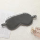 Dark gray satin sleep eye mask with elastic strap, smooth double-sided fabric.