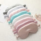Multi-color satin sleep masks with elastic straps: white, pink, teal, and pastel tones.