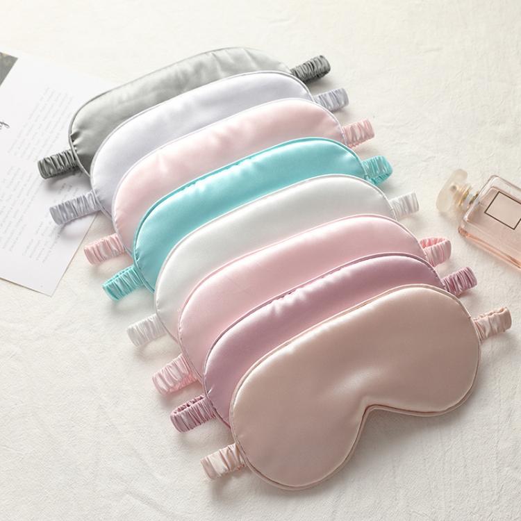 Multi-color satin sleep masks with elastic straps: white, pink, teal, and pastel tones.