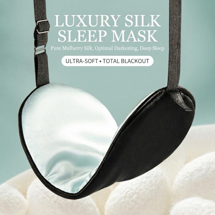Black silk sleep mask with adjustable latex strap and buckle, curved eye shape