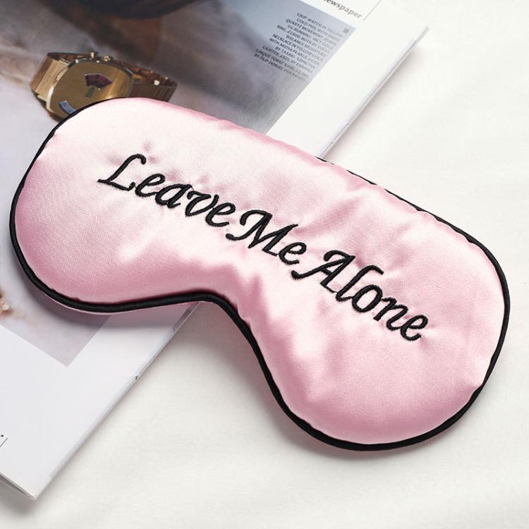 Pink satin sleep mask with “Leave Me Alone” embroidery and black trim