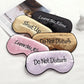 Set of satin sleep masks with “Leave Me Alone” and “Do Not Disturb” text