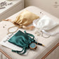 Small satin drawstring jewelry pouches, green, gold, and white on gift cards