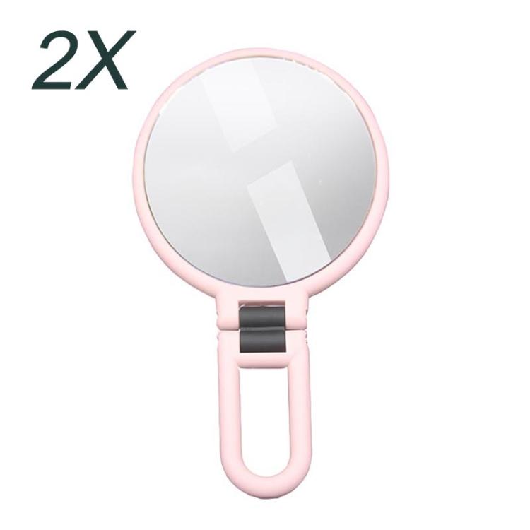 2X magnifying makeup mirror with round glass and pink folding handle