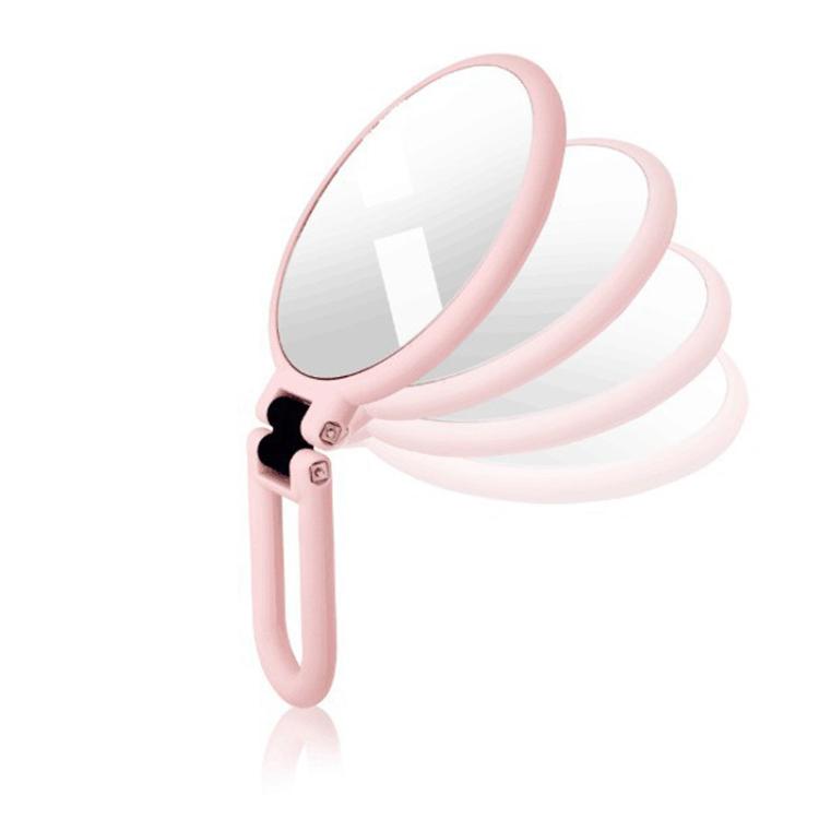 Pink folding magnifying mirror with stacked round glass panels and handle