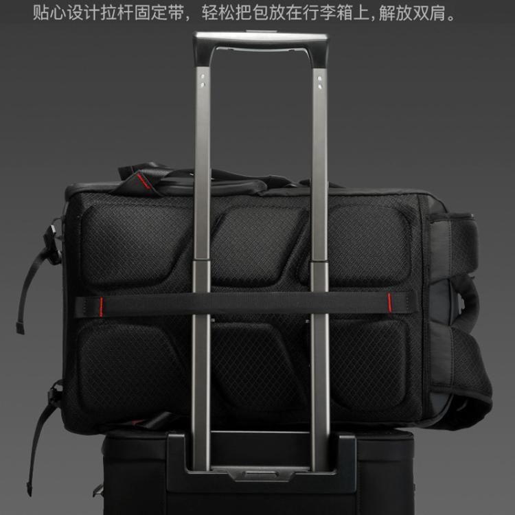 Backpack with integrated luggage handle system for stacking on rolling suitcases