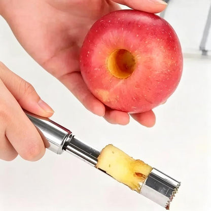Stainless steel fruit corer and pitter tool removing core from a red hawthorn fruit