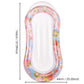 Inflatable water lounger with pastel flower print and translucent glitter outer rim