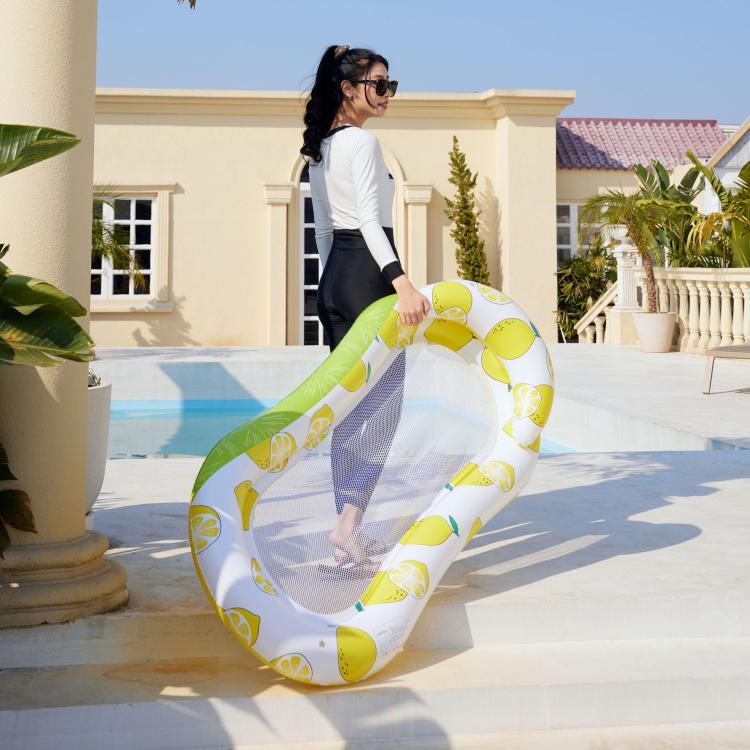 Inflatable floating bed lounger with yellow lemon print and clear mesh center