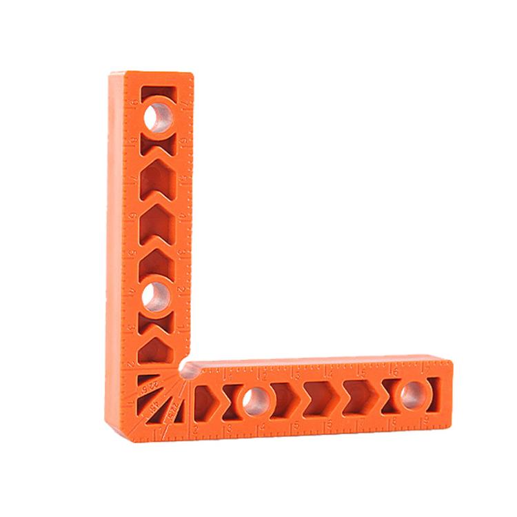 Orange L-shaped corner bracket with measuring notches and circular holes along the arms.