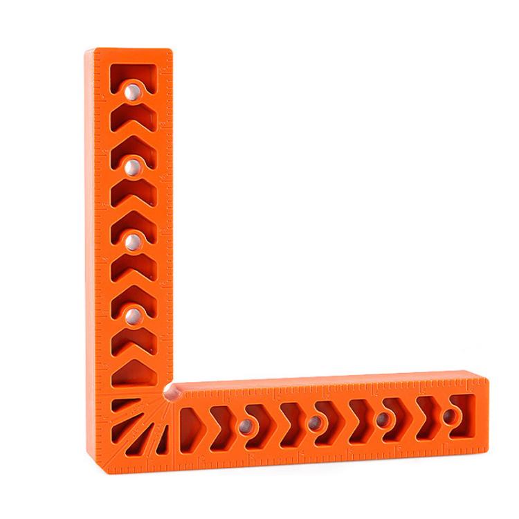 Orange L-shaped corner bracket with vertical notch marks and circular pin holes.