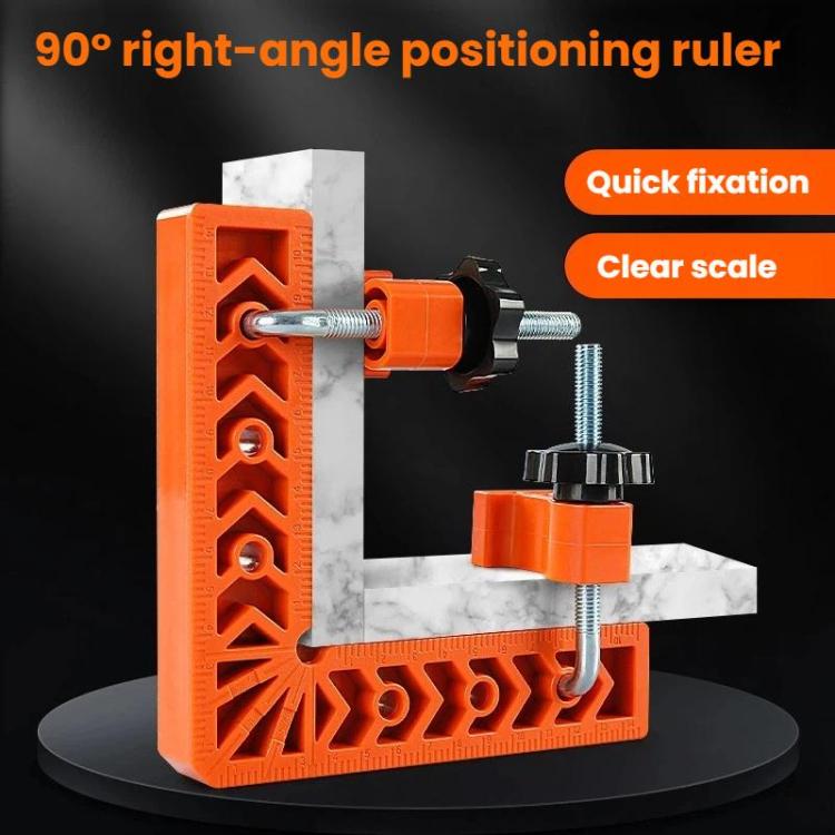 Orange right-angle positioning ruler with clamp hardware and marked measurement scale.