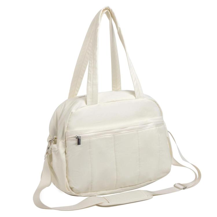 Cream travel bag with compartments, top handles, and zippered front pocket