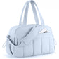 Light blue travel bag with compartments, padded strap, and zippered front pocket