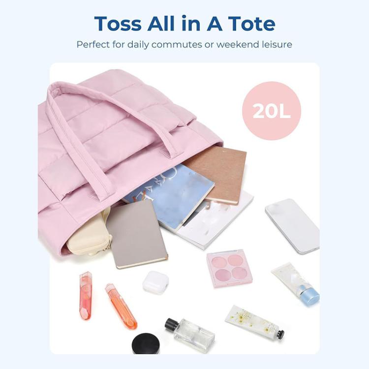 Pink multi-compartment tote bag with open top and assorted daily items inside