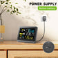 Wireless weather station with power supply box and display on wooden surface