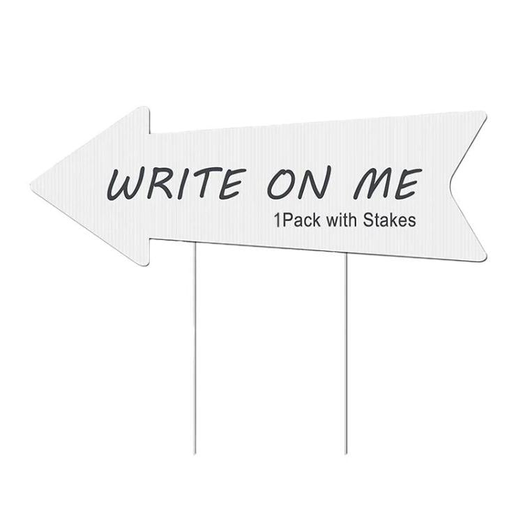 White write-on arrow yard sign with stakes, 'WRITE ON ME' text