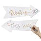 White arrow yard sign for weddings with 'Wedding' lettering and small drawings