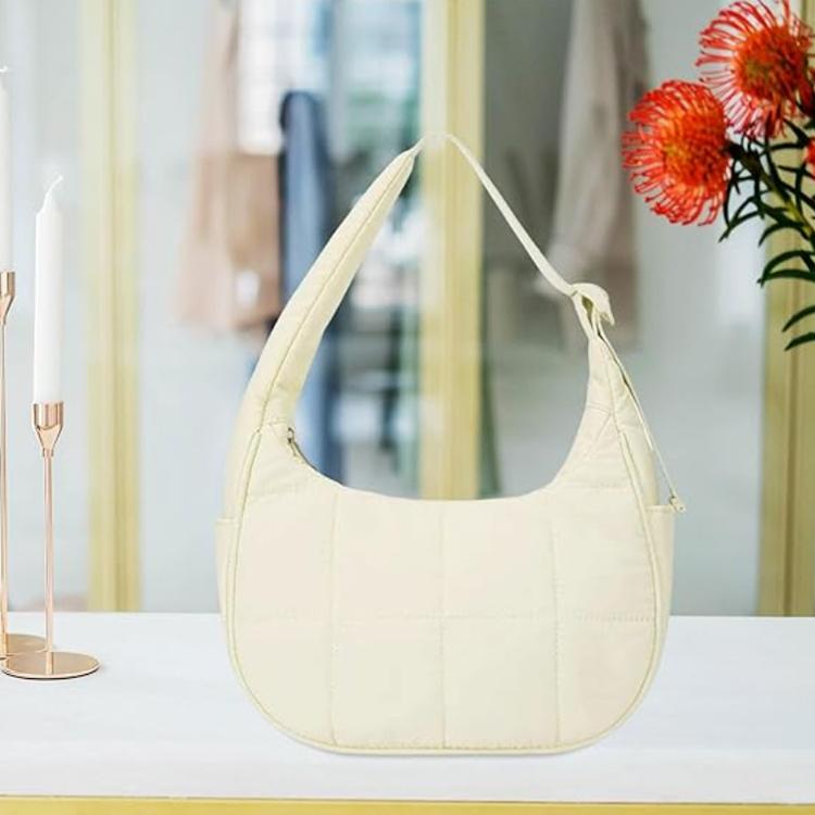 Cream puffer single-shoulder handbag with adjustable strap and crescent hobo shape
