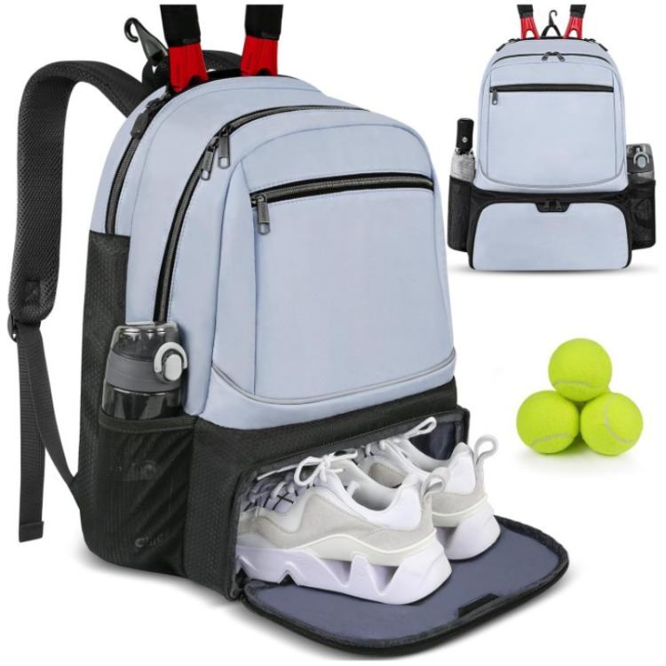 Light blue travel layered bag with open shoe compartment, front zip pocket, and side mesh holders