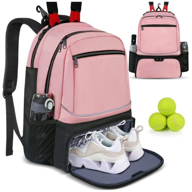 Pink travel layered bag with open shoe compartment, front zip pocket, and side mesh holders