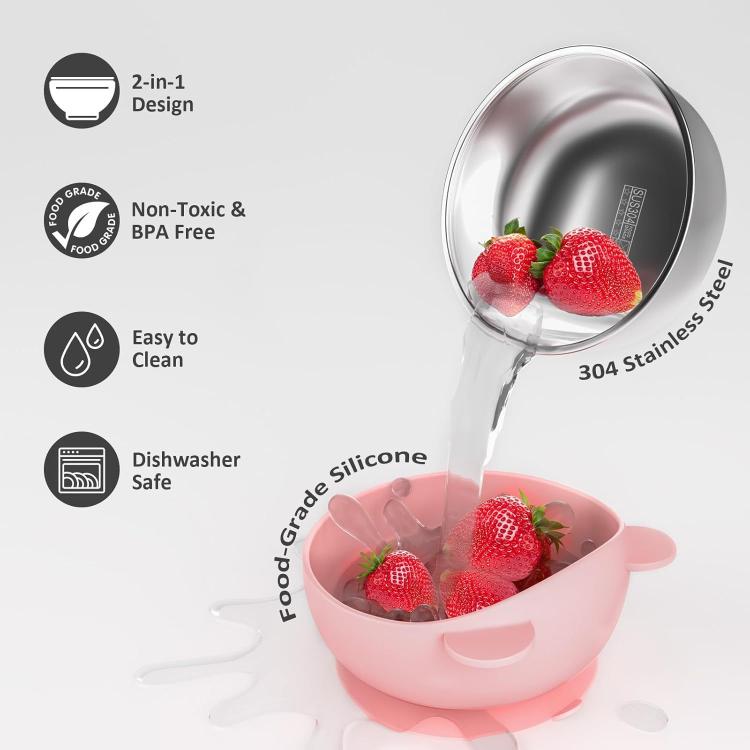 Pink silicone toddler feeding bowl with 304 stainless steel inner, holding strawberries.