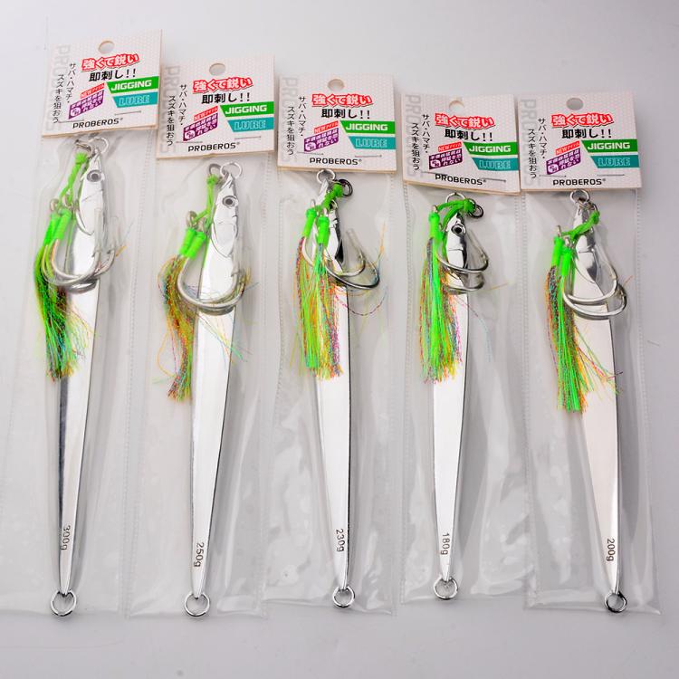 Assorted pack of silver fishing jig lures with green feather accents in individual blister cards