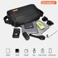 Black crossbody bag laid out with small carry items including phone and wallet