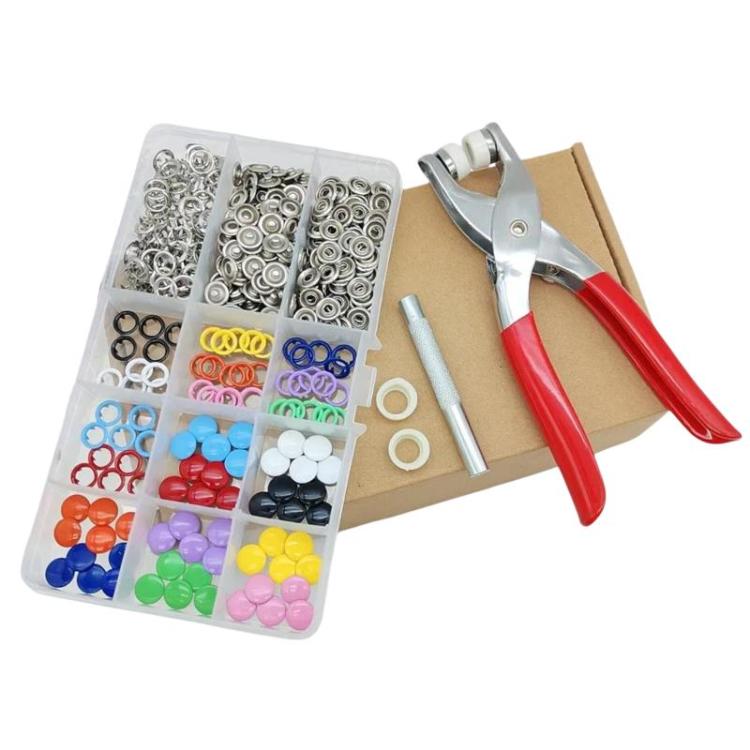 Snap button fastener kit with clear organizer case, red-handled plier tool, and snap parts