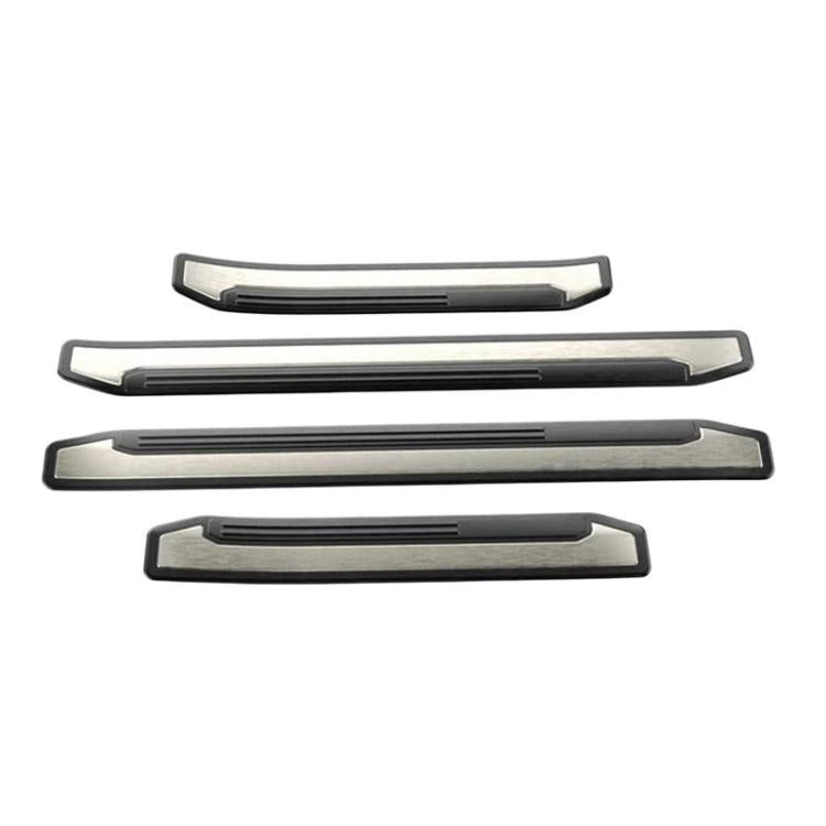 Set of stainless-look car door sill protector strips with black insert lines
