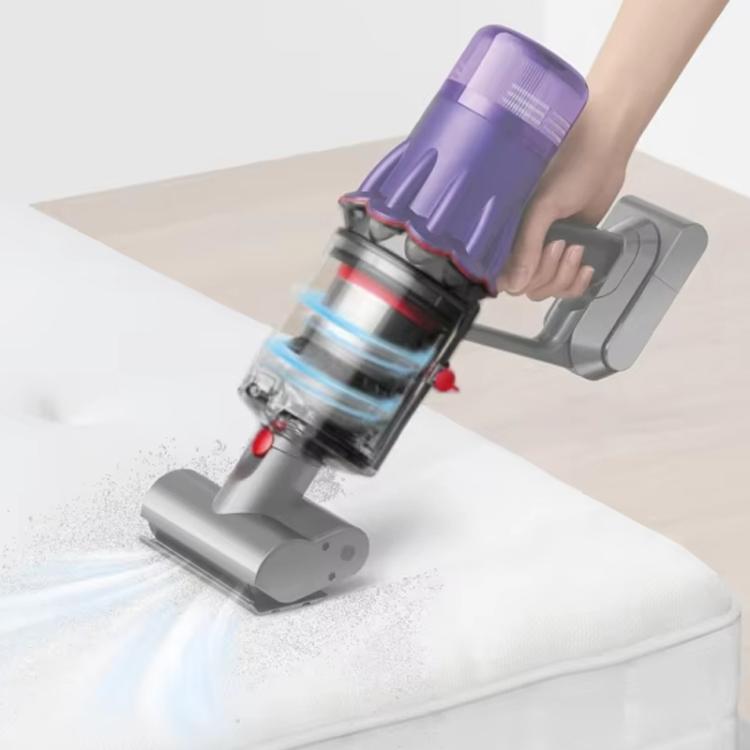 Clear dust bin assembly with red parts attached to cordless vacuum during use