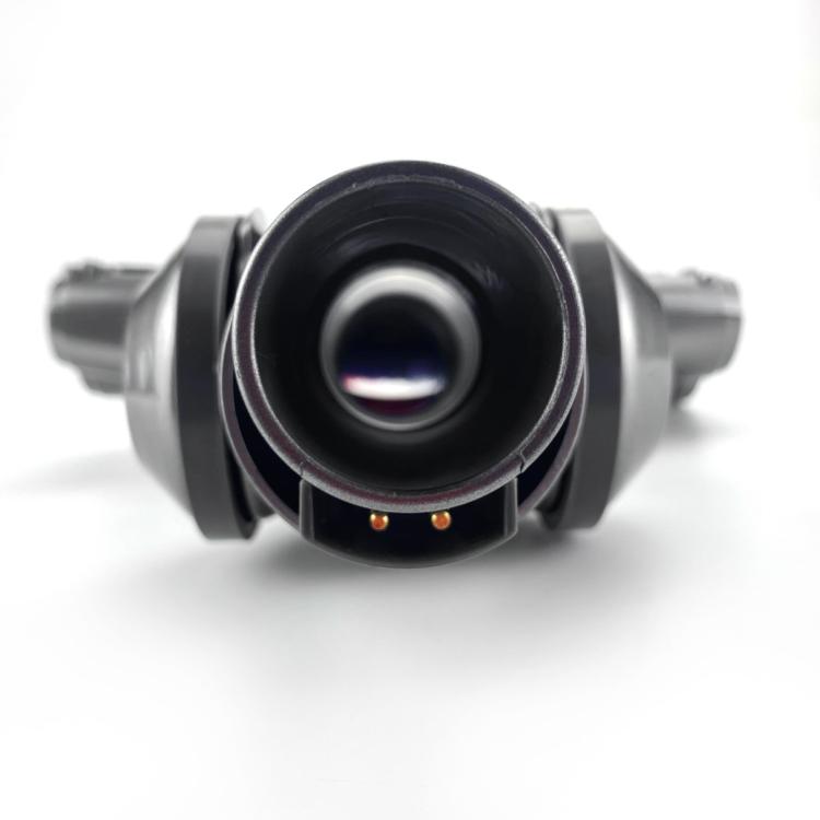 Vacuum motorized brush head front opening with dark gray housing and small indicator dots