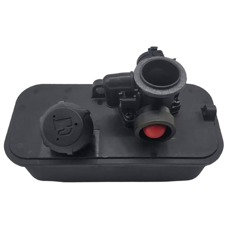 Mechanical carburetor with black housing and intake opening, red diaphragm control