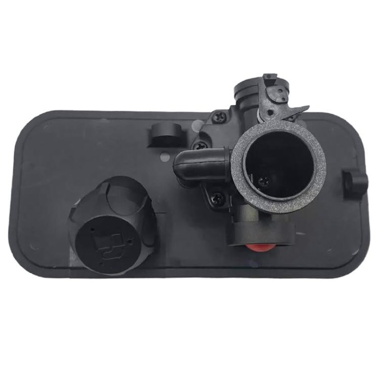 Mechanical carburetor with black body, red control element, and intake tube