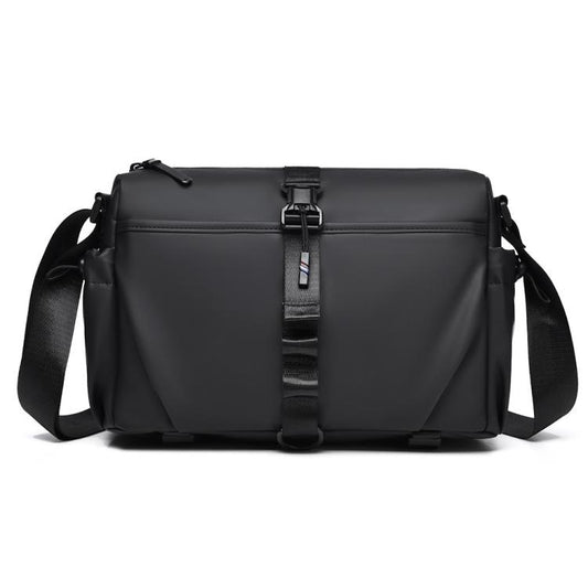 Men's black sling bag with magnetic front buckle and adjustable shoulder strap