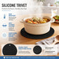 Round black silicone trivet with honeycomb non-slip surface under a hot pot