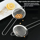 Stainless steel round mesh strainer with long handles holding small beans