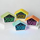 Set of house-shaped digital alarm clocks with glowing LED time displays in multiple colors
