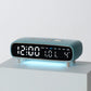 Sky blue digital alarm clock with date, weekday, temperature, and time display on front