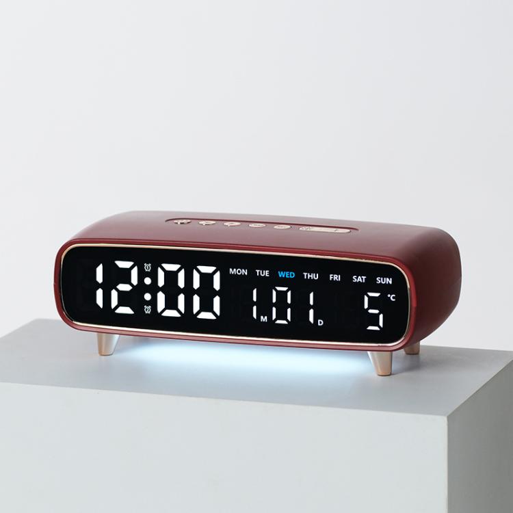 Burgundy digital alarm clock with date, weekday, temperature, and time display on front