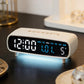 White digital alarm clock with large time and weekday display on front