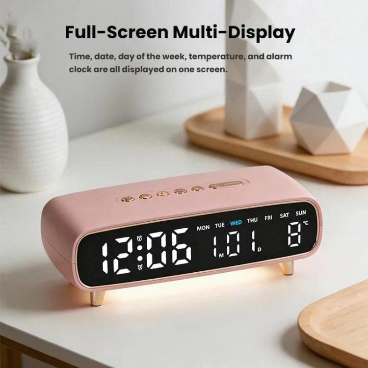 Pink digital alarm clock with full-screen time, date, weekday, and temperature display