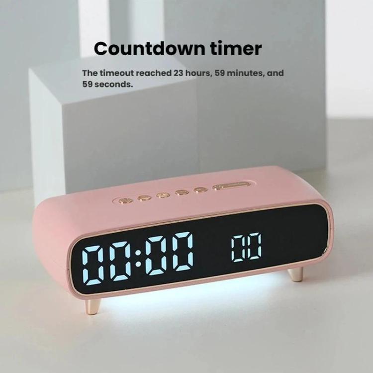 Pink LED digital alarm clock showing countdown timer 00:00 and alarm indicator