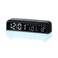 Black digital alarm clock with large LED time display and night light base