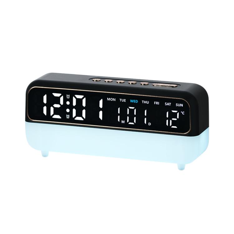 Black digital alarm clock with large LED time display and night light base