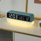 Teal digital alarm clock with LED time display and warm glowing night light